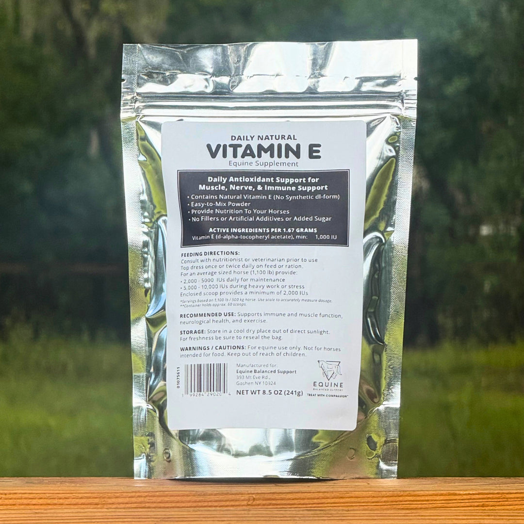 Vitamin E supplement package with a natural background