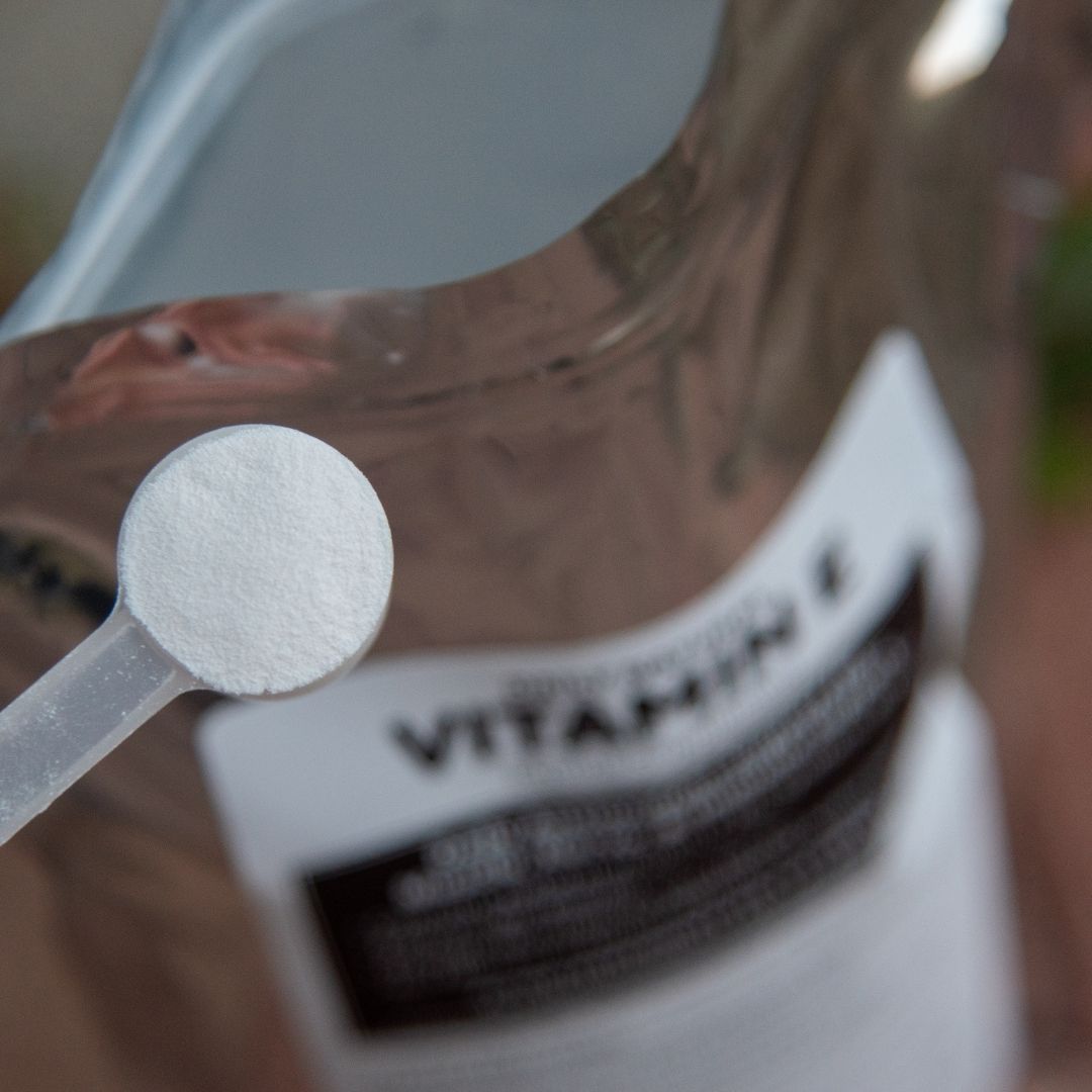 Close up view of 25.5 oz Bag of Daily Natural Vitamin E Powder in the highly concentrated 3.34g scoop, providing 2000 IU per scoop.